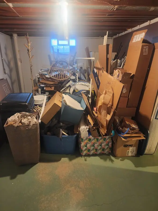 Roll-off dumpster container at job site for 2 Yard Dumpster Rental in Carter Lake